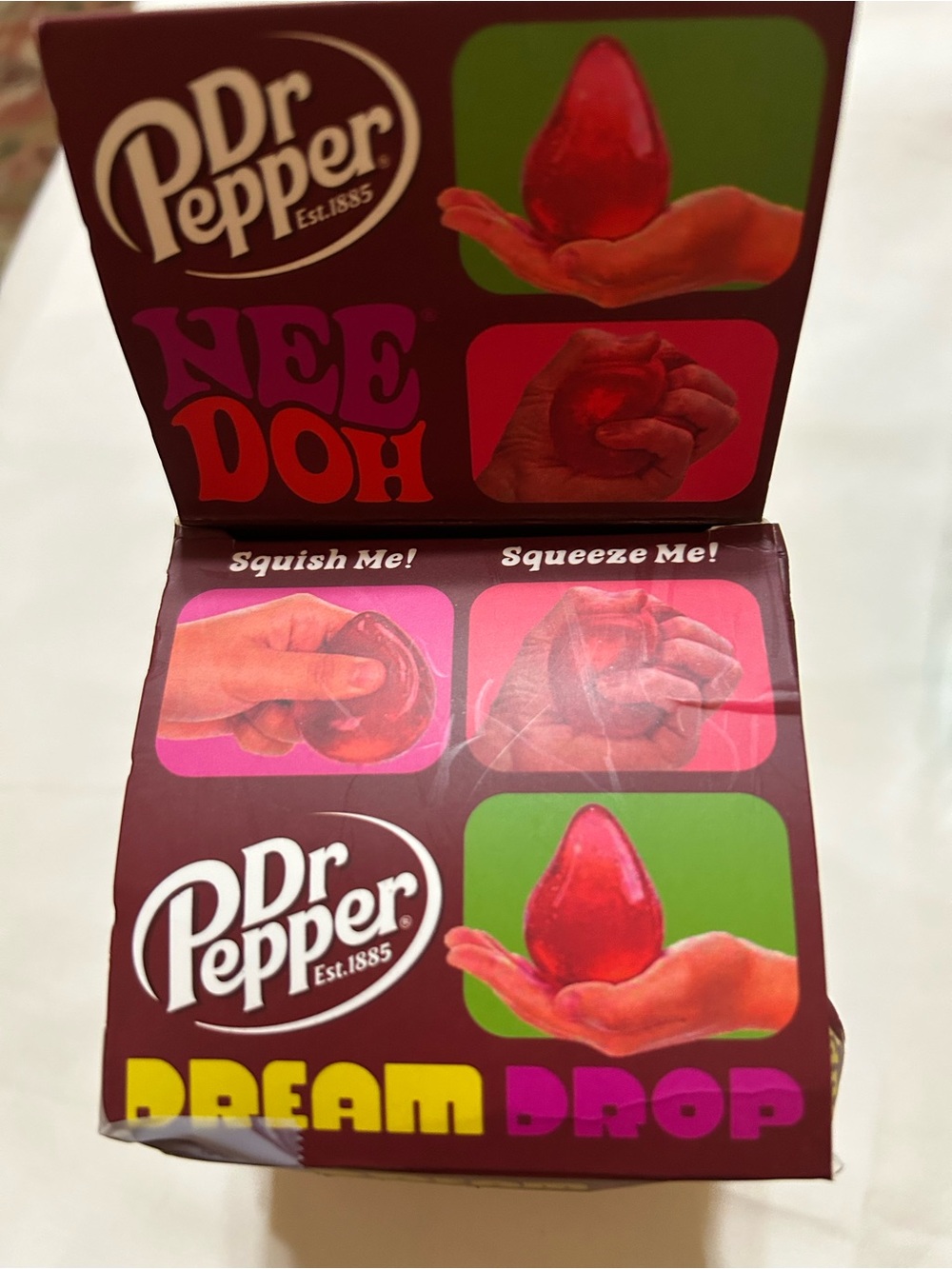Red NeeDoh Dream Drop - Stress Relief Squishy Toy. Dr Pepper